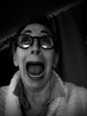 Woman with wild expression in black and white selfie,